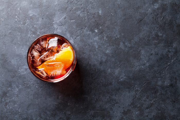 Negroni cocktail on dark stone table